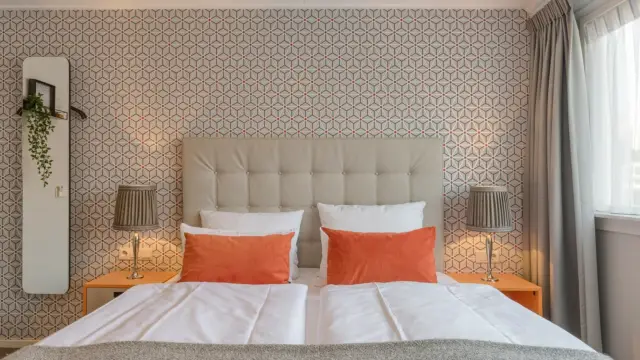 Hotelkamer bed Hotel Op Diek VVV Texel