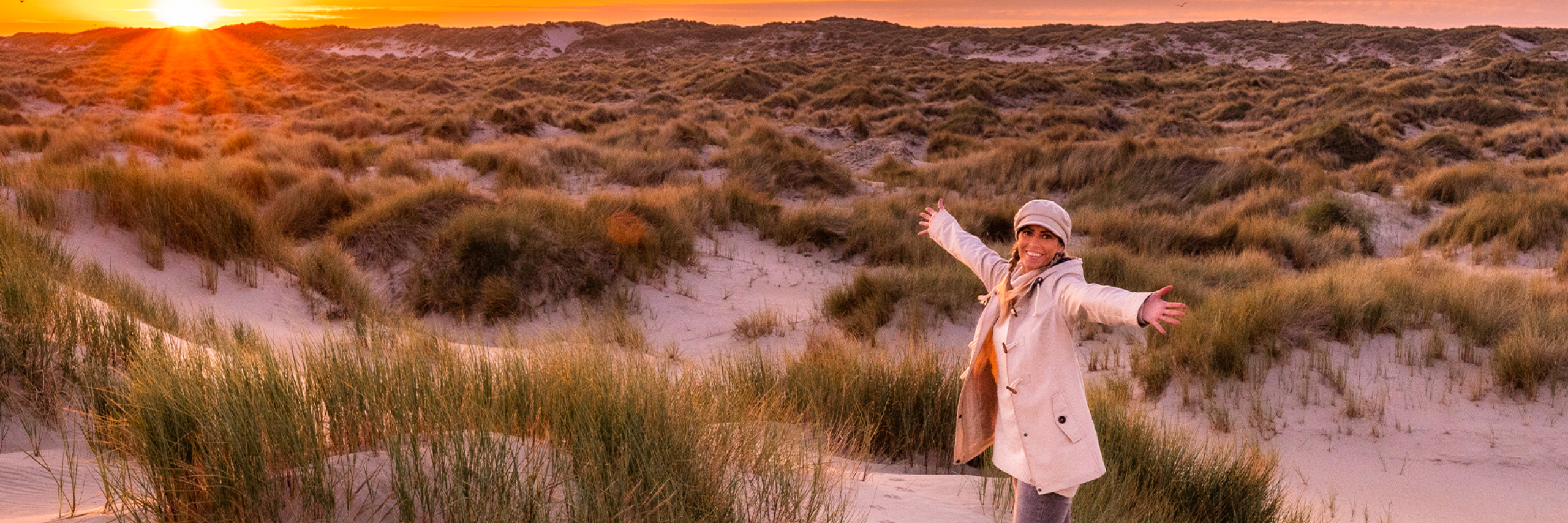 Zonsondergang duinen uitwaaien