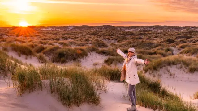 Zonsondergang duinen uitwaaien
